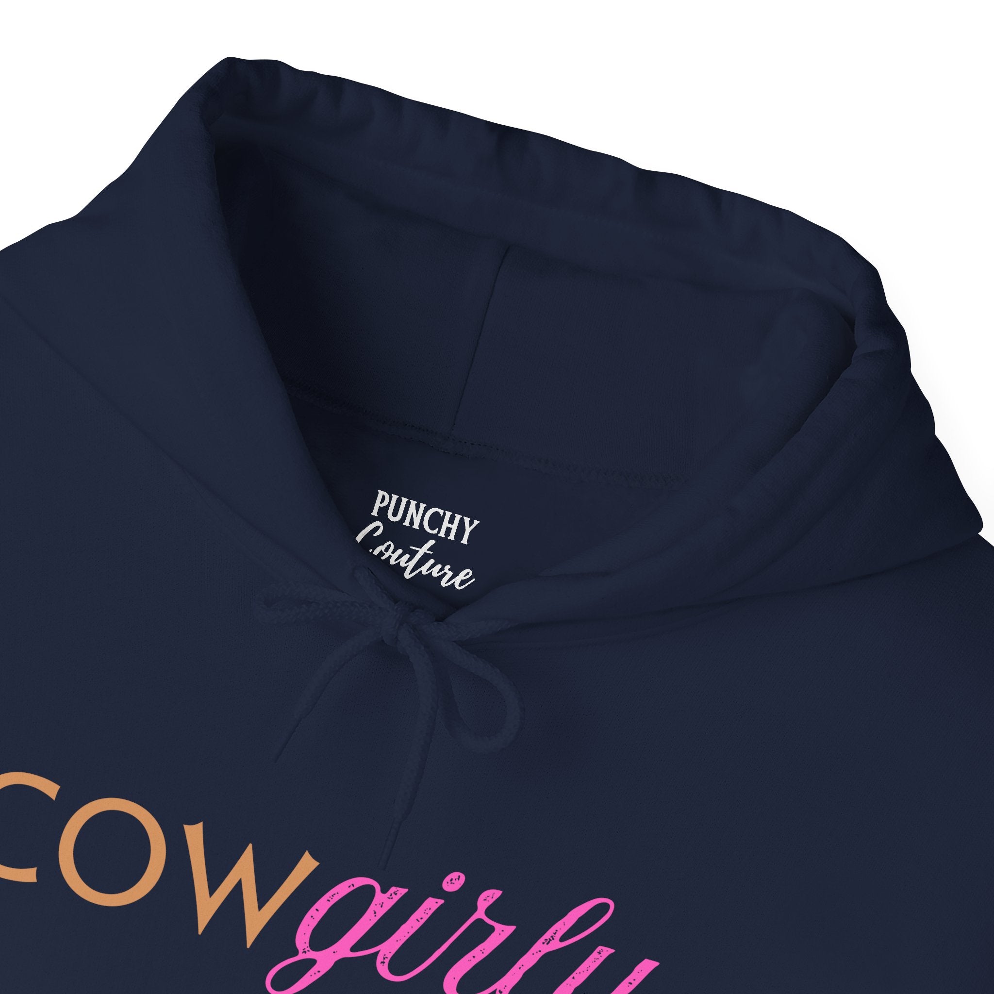 Navy hooded sweatshirt with orange block "COW" and pink cursive "girly" printed across the chest; bold Western hoodie with playful, confident energy