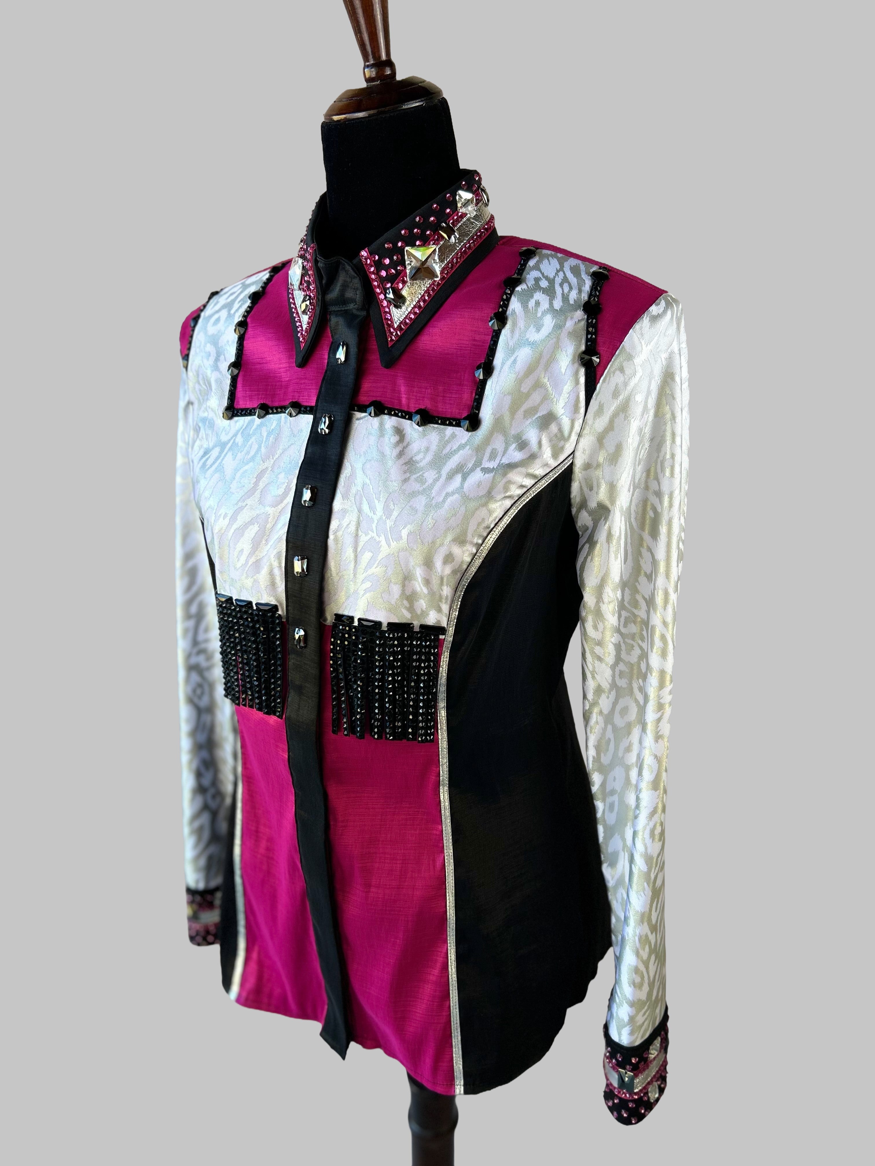 Western-style performance shirt in magenta, black, and silver with ornate rhinestones, studs, and beaded accents; dramatic show-day design featuring jacquard textures, barbed embellishments, and couture-level craftsmanship.