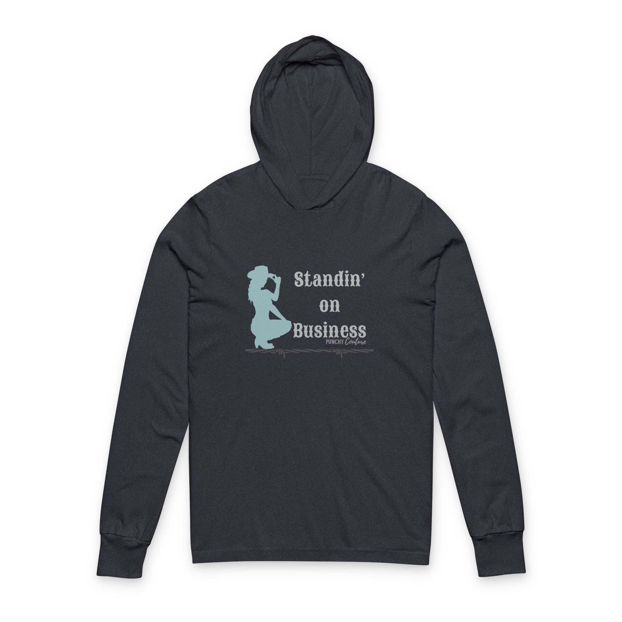 Black hooded long-sleeve shirt with light blue silhouette of a confident cowboy and bold text reading “Standin’ on Business” with “PUNCHY Couture” branding; Western streetwear with assertive energy.